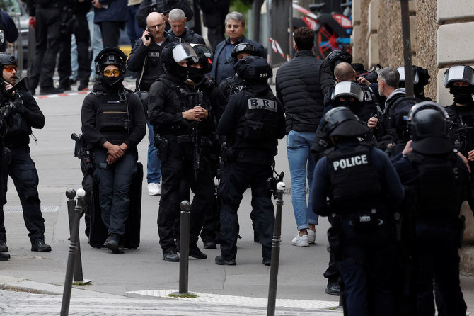 French police cordoned off Iranian consulate in Paris where a man is threatening to blow himself up
